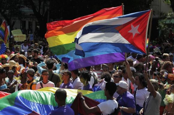 People take part in gay pride parade during an event ahead of International Day Against Homophobia in Havana
